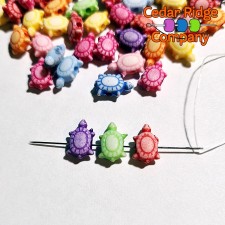 Turtle beads on a needle